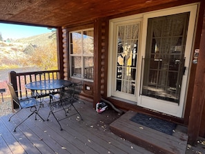 Cabin entrance and outdoor dining table