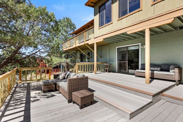 Outdoor patio with spacious multi decks, view of mountains