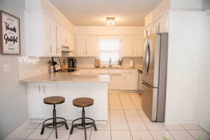 Updated kitchen with new stainless steel appliances.