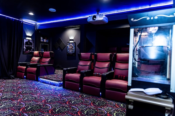 Private Custom Deadpool Movie Theater with reclining chairs and popcorn machine