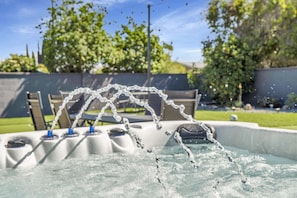 The jacuzzi offers a soothing soak with warm, bubbling water, perfect for relaxation and unwinding.