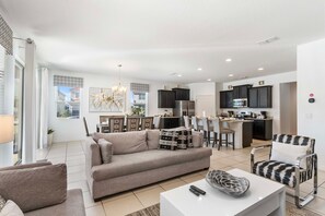 Beautiful home in Davenport Florida - Plush and comfortable seating arrangements - Entertainment hub with a Smart TV - Spacious open-plan design for a modern feel - Stylish, contemporary furnishings enhancing the aesthetic