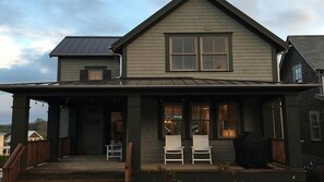 Covered porch with seating and gas grill