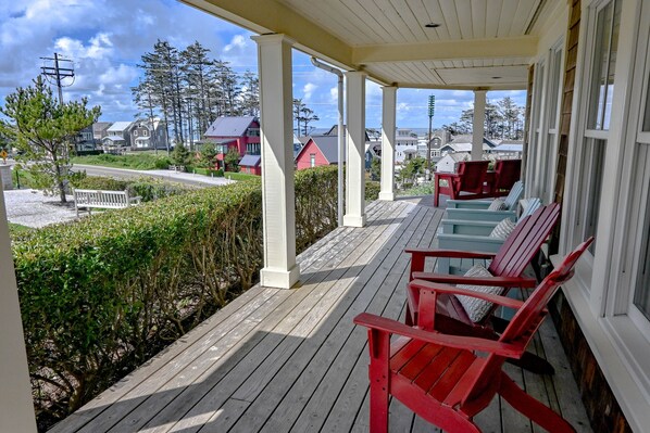 The wrap-around front porch offers the perfect spot to unwind and take in the views
