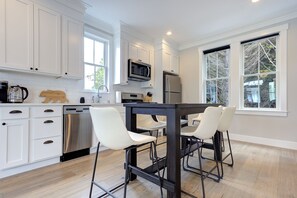 The dining table doubles as a kitchen island