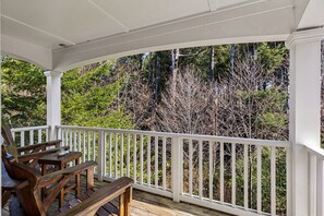 Balcony with seating and forest view