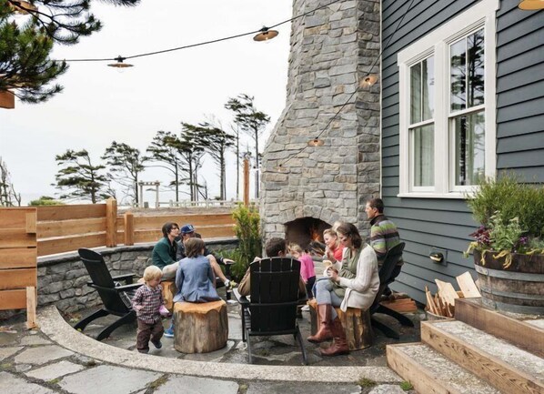 Enjoy the ocean view and stone fireplace in the courtyard