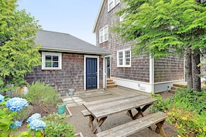Courtyard with picnic table and fire pit	