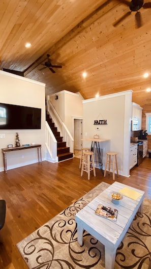 Roku TV with loft to two twin beds above. 