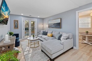 Living Room with queen pull out sofa bed. Private balcony.