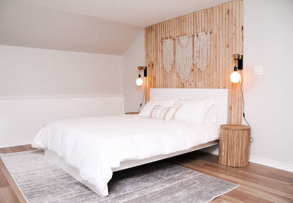 Master bedroom with wood feature wall