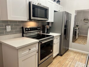 Quartz kitchen counters, and brand new Kitchen Aid SS appliances