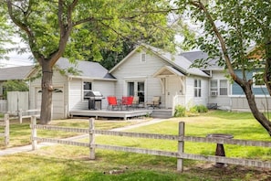 Lovely outdoor space with large deck and mature trees