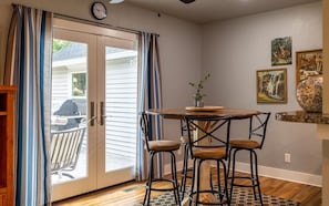 Dining area with French doors opens to the outdoor seating area