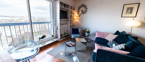 Living room offers a breath-taking view over the city.