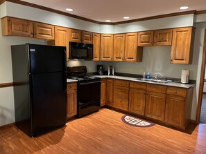 Full kitchen in Apartment A for easy meals between games