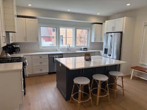 New kitchen--just remodeled!  Crown molding coming soon. New cabinetry, appliances, and hardwood flooring. 