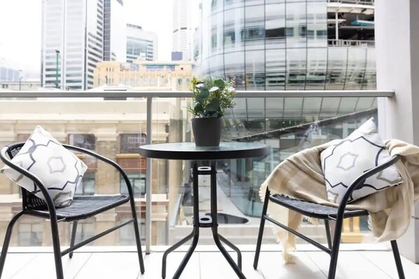 A private balcony with a setting.