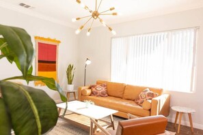 Stylish living room with hand woven tapestries, great to relax in!