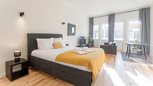 Bright main area with a cozy queen bed #comfort