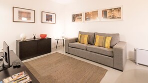 Cozy sofa area with a TV and a heater for comfortable moments #heater #cozy #airbnb