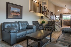 Living room with comfy seating HD TV