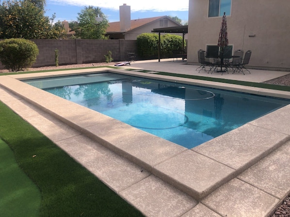 Private backyard, bbq, cornhole, seating and pool(not heated)