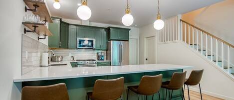 Beautiful custom kitchen with plenty of seating for all!