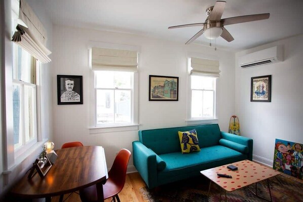 Local art prints, famous authors prints, and original art adorn the walls of this bright and comfortable apartment.