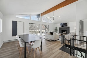 Hang out in the open concept living and dining with 12ft ceilings and Smart TV!