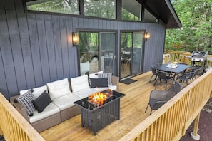 Cozy up by the propane firepit on the elevated tree-top deck this spring.
