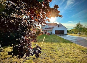 Experience the breathtaking beauty of our newly-renovated coastal farmhouse, situated on 1.9 acres and boasting stunning sunsets! There is ample parking for your group so you can explore the beauties of Northern Michigan to your heart's content.