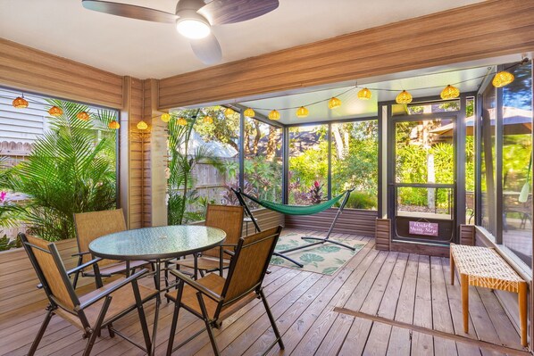 Relax in the screened in patio in the backyard!