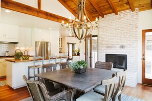 Kitchen dining table, seats six plus island. Wood burning fireplace. 