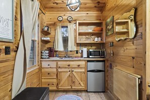 Kitchenette includes small fridge/freezer, microwave and Keurig with pods