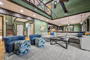 Open-layout living area w/ stair access to second level.
