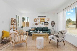 Comfy living room with mini split HVAC and great natural light. Great for escaping the desert heat after a fun day of hiking!