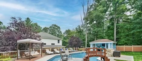 Private pool with pool house, cabana and large deck for all outdoor summer fun.