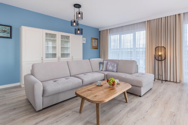 A bright and cozy living room with modern furniture and warm tones.