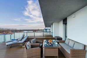 A stunning terrace with a beautiful view and outdoor seating for relaxation.