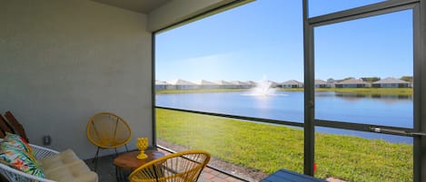 lake and sunset view from the screened lanai