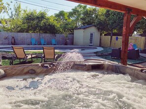 Hot tub overlooking the pool. Hot tub is heated all the time