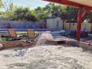 Hot tub overlooking the pool. Hot tub is heated all the time