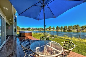 Amazing views of the water and mountains from the back deck - Enjoy a meal and the amazing views of the water and mountains from the back deck