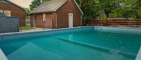 Enjoy this private, in-ground pool for a great coastal retreat in Hampton Roads.