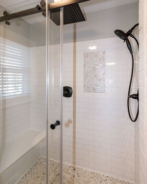 Great tiled shower w/ bench, rain head & adjustable shower head!