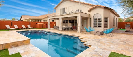 Amazing backyard w/ beautiful lap pool, outdoor games available, lounge chairs.