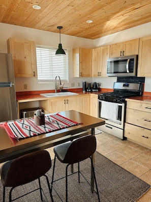 Fully equipped kitchen! Dinning table can also double as a workspace