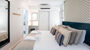 Bedroom area includes an AC unit for a comfortable stay all year round! #AC #comfort