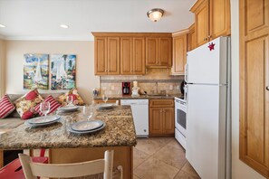 Fully Equipped Kitchen - This large kitchen includes everything you need to prepare simple snacks or full-course meals for you and your guests. It is a pleasure to use.